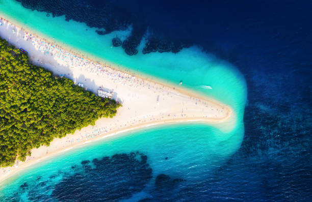 Croatia, Hvar island, Bol. Panoramic aerial view at the Zlatni Rat. Beach and sea from air. Famous place in Croatia. Summer seascape from drone. Travel - image Croatia, Hvar island, Bol. Panoramic aerial view at the Zlatni Rat. Beach and sea from air. Famous place in Croatia. Summer seascape from drone. Travel - image brac island stock pictures, royalty-free photos & images