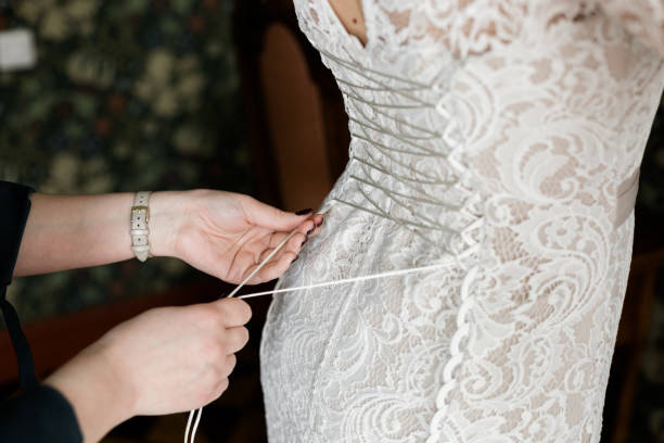 istock Lacing the wedding dress. 1159471672