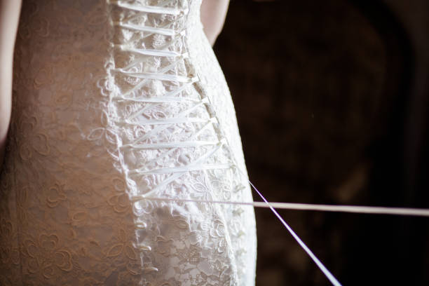 istock Lacing the wedding dress. 1159471857