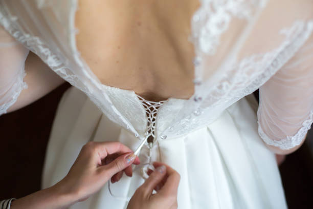 istock Lacing the wedding dress. 1159472465