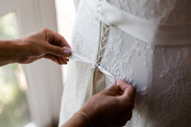 istock Lacing the wedding dress. 1159473431