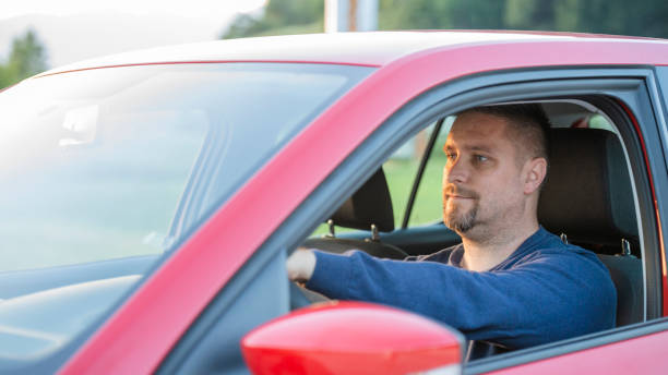 istock Mid adult man driving his car 1159473638