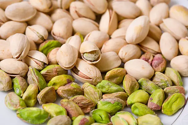 Shelled and unshelled roasted pistachios.