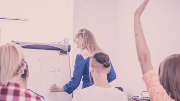 istock Teacher teaching mathematics to college students 1159476271