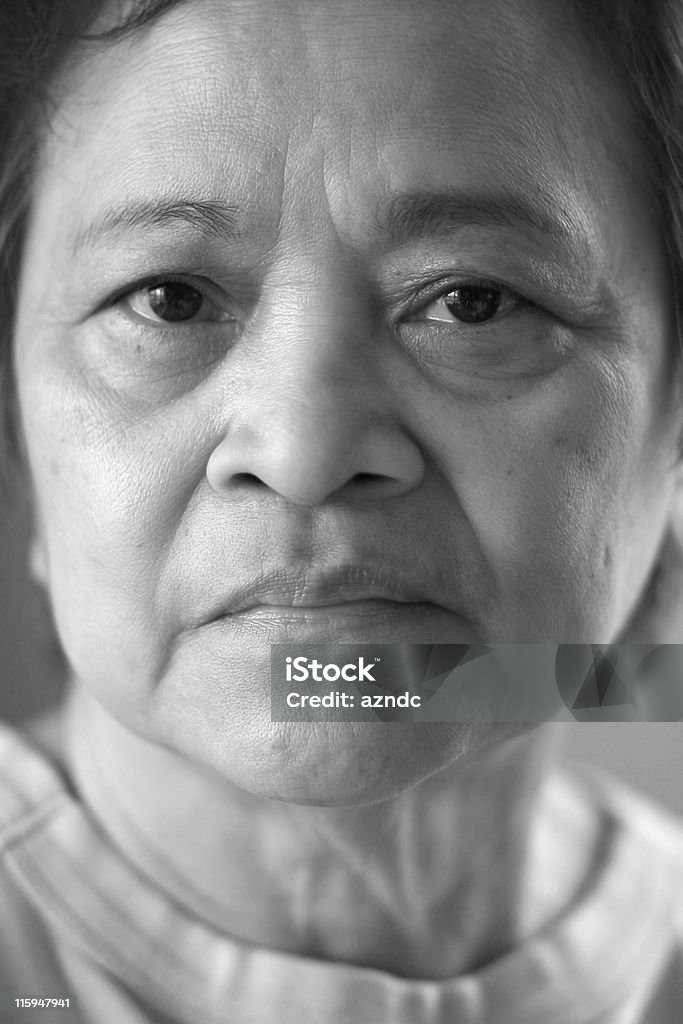 Mature Asian Woman Black & white extreme close-up of Asian / Pacific Islander senior citizen. 60-69 Years Stock Photo
