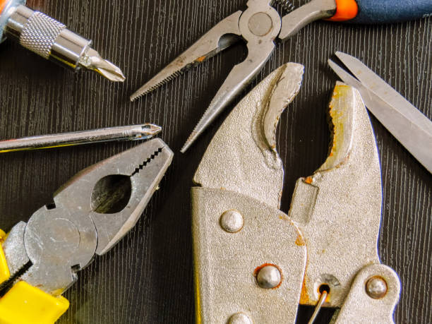 istock Various kind of tools with wood background 1159480675