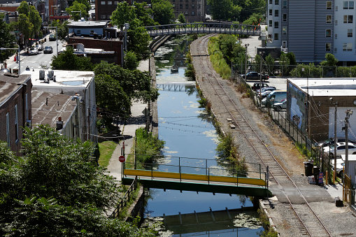 Philadelphia, PA, USA - July 1, 2019: Overview scene of homes by the Manayunk Canal Towpath in Philadelphia, Pennsylvania.