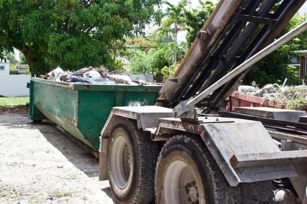 Debris from residential  construction site collected in container for efficient disposal