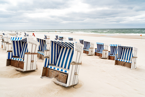 Beach - chairs on the island Sylt vertical. Germany.