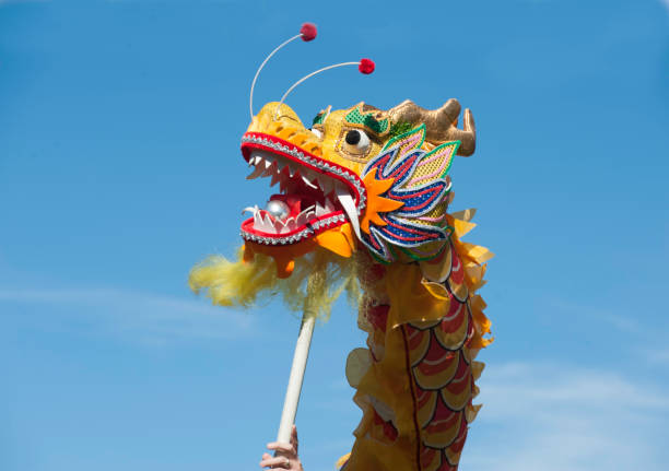 istock chinese New Years Dragon against Blue sky 1159485040