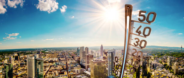 Heat wave over Germany Panorama of Frankfurt am Main on a hot summer day with bright sun and big thermometer hesse germany photos stock pictures, royalty-free photos & images