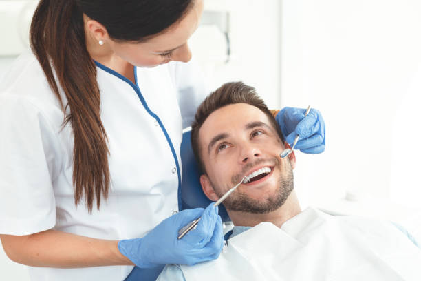 istock Man having teeth examined at dentists 1159486048