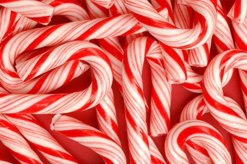 Candy canes on red background