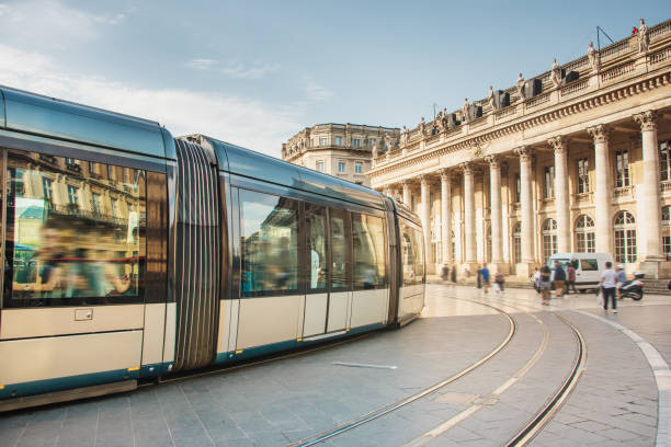 modern tramway in bordeaux, france - blurred motion street car green imagens e fotografias de stock