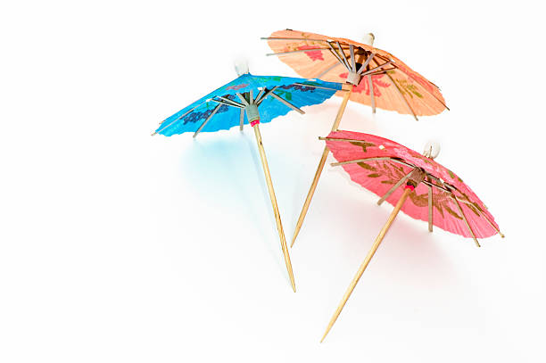 tre parti ombrelloni - drink umbrella umbrella parasol small group of objects foto e immagini stock