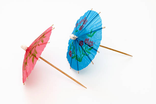 ombrelloni due parti - drink umbrella umbrella parasol small group of objects foto e immagini stock