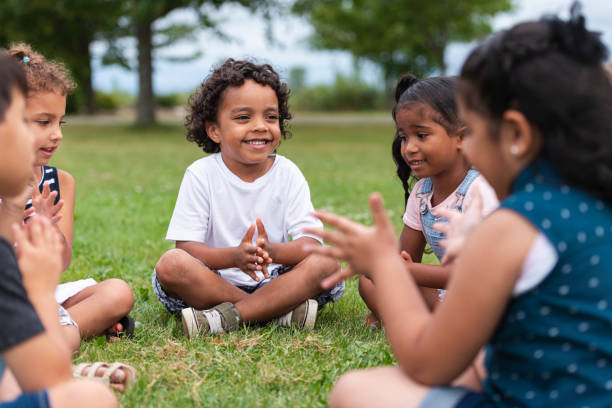 istock A Multi-Ethnic Group of Young Children are Clapping Outside 1159495559
