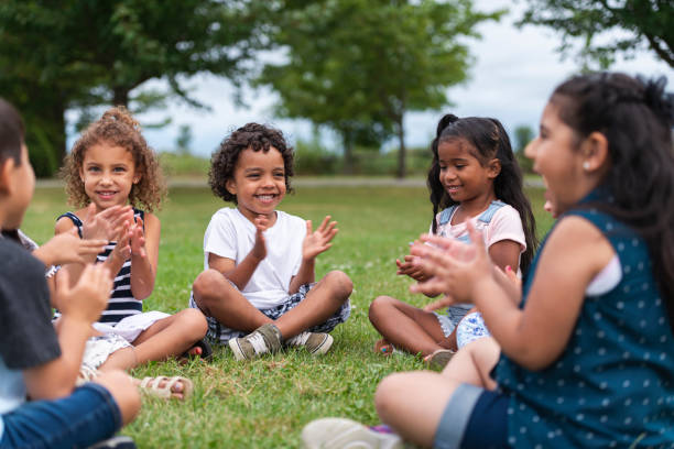 istock A Multi-Ethnic Group of Young Children are Clapping Outside 1159495563