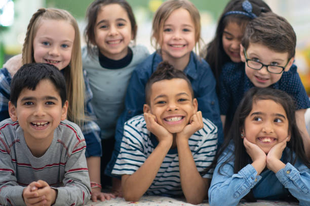 istock Group portrait of smiling elementary kids 1159495613