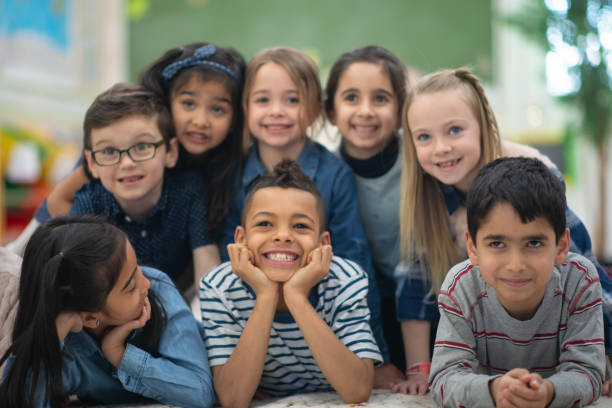 istock Group portrait of smiling elementary kids 1159495614