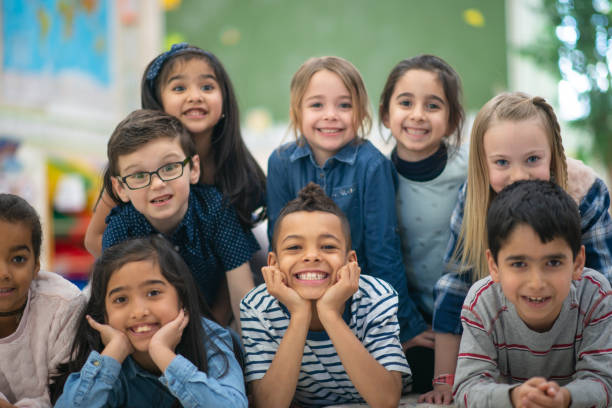 istock Group portrait of smiling elementary kids 1159495617