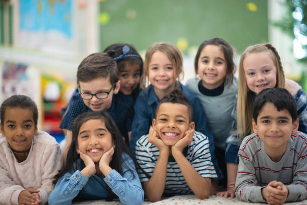 istock Group portrait of smiling elementary kids 1159495618