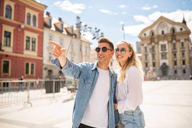 istock Young couple walking in a city 1159496740