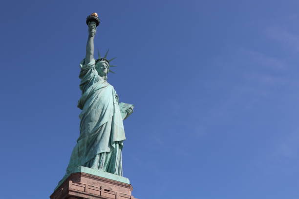 istock Statue of Liberty on a sunny spring day 1159498746