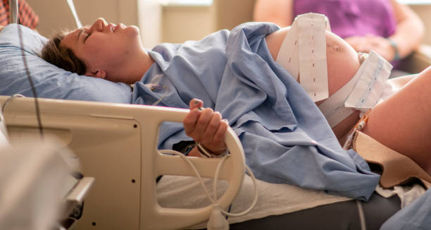 istock Young woman in childbirth 1159500441