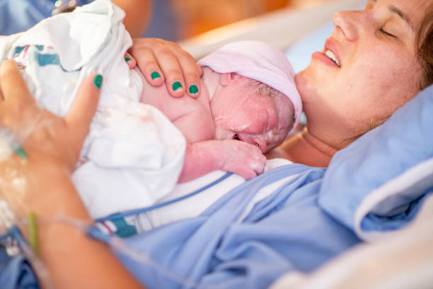 istock Young mother with her newborn baby 1159500453