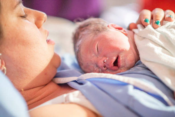 istock Young mother with her newborn baby 1159500456