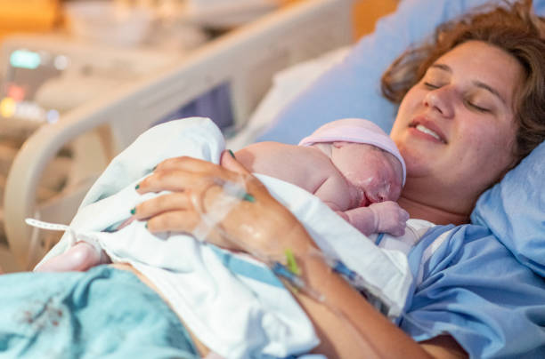 istock Young mother with her newborn baby 1159500458