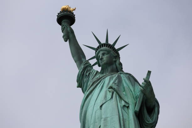 istock The Statue of Liberty over a cloudy sky 1159502263