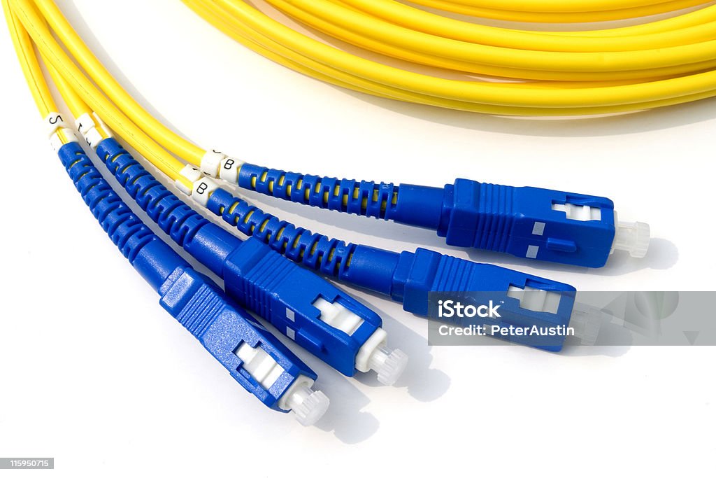 Fibre Optic Network Cables Network cables with blue connectors Computer Cable Stock Photo