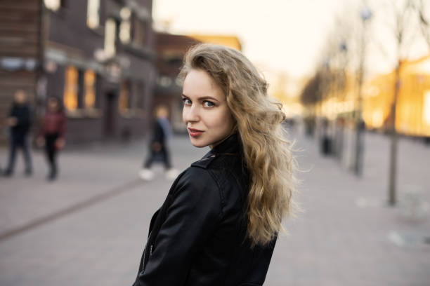 istock attractive curly blond girl 1159507992