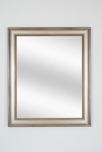 Picture frame in silver or pewter with digital mirror inserted, isolated on white background.