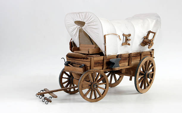 istock A covered wooden wagon with a canopy 115950992