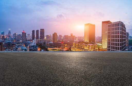 Shanghai skyline panoramic view with asphalt road at sunset,China
