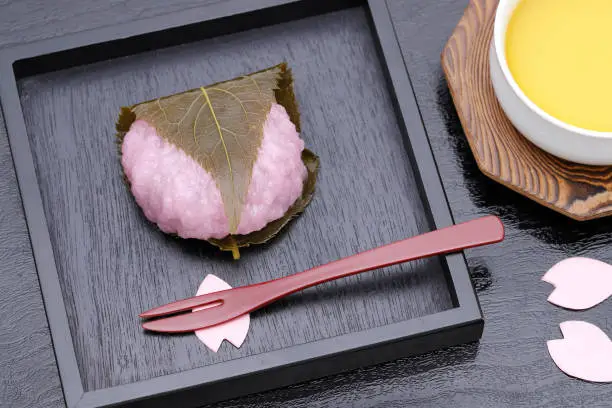 Japanese sakura mochi dessert for spring season cherry blossom made of rice cake