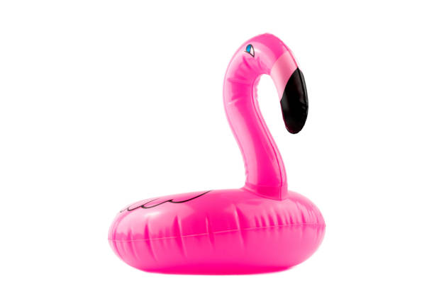 istock Mini pink flamingo isolated on white background. Summer beach composition. Flat lay, copy space. 1159517993