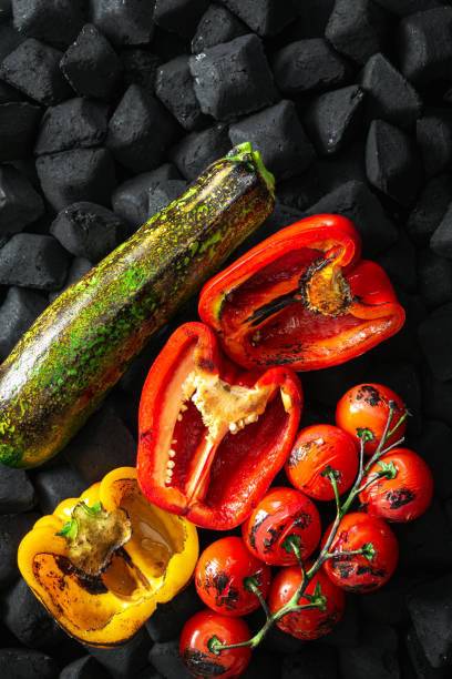 Cooked vegetables grilled over charcoal top view