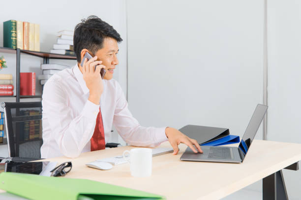 istock Asian business man at office 1159524557