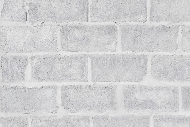 istock Abstract weathered high resolution texture old stucco light gray and aged paint white brick wall background in rural room, 1159524830