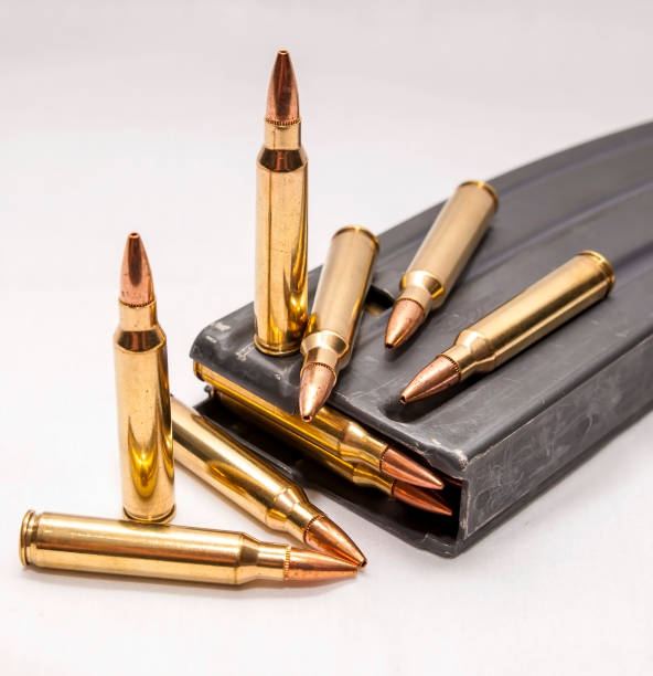 istock 223 caliber bullets along with a loaded 223 caliber rifle magazine 1159525850
