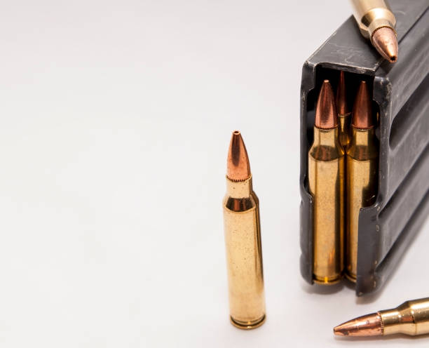 istock 223 caliber bullets along with a loaded 223 caliber rifle magazine 1159525853