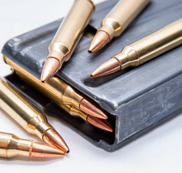 istock 223 caliber bullets along with a loaded 223 caliber rifle magazine 1159525854