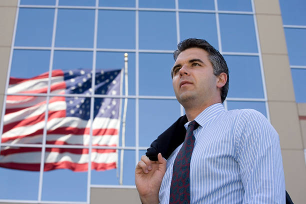 Businessman looking into the distance stock photo