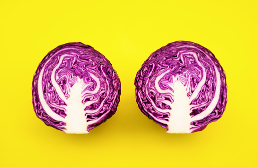 Fresh of purple cabbage (half sliced)on color background.Natural vegetable, healthy vegetarian food.healthy eating lifestlye concepts ideas