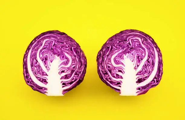 Photo of Fresh of purple cabbage (half sliced)on color background