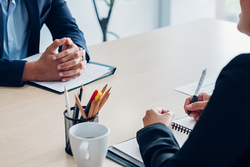 Close up interviewer interview candidate apply for job at meeting room in office